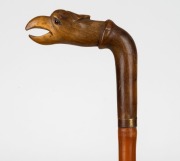 An antique walking stick with carved horn bird's head handle, cane shaft and copper ferrule, 19th century, 84cm high - 2