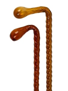 A pair of antique English amber coloured Nailsea glass walking sticks, 19th century, ​​​​​​​101cm and 99cm high