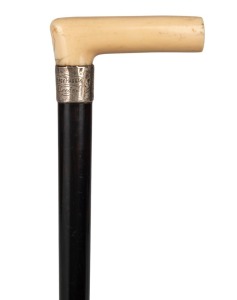 An antique walking stick with carved ivory handle, silver collar with engraved ownership details "PERCY HAGGAS, LEEDS", ebony shaft and brass ferrule, 86cm high
