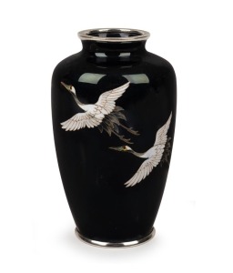 An vintage Japanese cloisonne vase with two flying cranes on black ground, 20th century, 12cm high