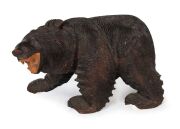A Black Forest style carved timber bear statue, 20th century, ​​​​​​​38cm high, 58cm long