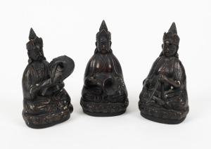 A group of three Chinese cast metal seated musical figures, 20th century, the largest 12cm high