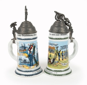 A pair of German porcelain beer steins with lithophane pictorial bases and figural pewter tops, 20th century, 28cm and 26cm high