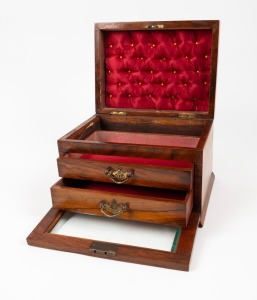 An antique walnut jewellery casket with lift top and fall-front bevelled glass door revealing two drawers, 19th century, 20cm high, 28cm wide, 22cm deep