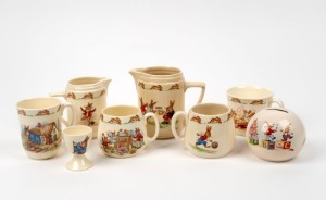 ROYAL DOULTON "BUNNYKINS" porcelain jugs, mugs, money box and egg cup, (8 items), some signed "BARBARA VERNON", the largest jug 12cm high