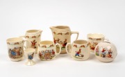 ROYAL DOULTON "BUNNYKINS" porcelain jugs, mugs, money box and egg cup, (8 items), some signed "BARBARA VERNON", the largest jug 12cm high