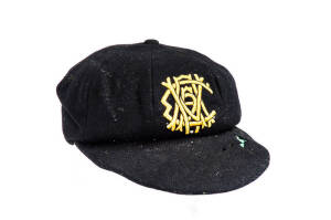 KEN MEULEMAN'S WESTERN AUSTRALIA CRICKET CAP, black with embroidered "WACA" monogram on front, signed inside by Ken Meuleman. Fair match-worn condition (some moth holes). [Ken Meuleman played 1 Test 1945-46, and played for Victoria 1945-51, and WA 1952-61