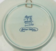 THE LONDON to MELBOURNE, MacROBERTSON CENTENARY AIR RACE 1934: Souvenir silver tea-spoon with "KLM UIVER" to the handle, the dates, route and a stork to the bowl. (11cm long); Also, a 50th Anniversary porcelain hanging plaque by Regina Delfts Blauw, Ooste - 2