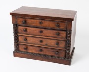 An antique French miniature chest of four drawers, veneered in rosewood with faux grain split bobbin turned columns and applied ripple decoration, circa 1860, 47cm high, 59cm wide, 29cm deep