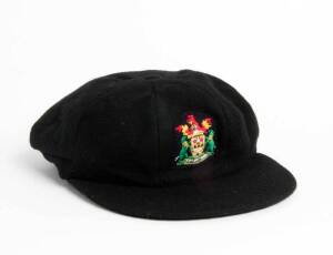 NOTTINGHAMSHIRE CRICKET CAP, black wool with Coat-of-Arms badge on front. G/VG condition.