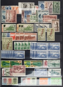 PAPUA NEW GUINEA: 1952 - 1998 accumulation in ex-dealer's stockbook; pre-decimals include 10/- Map (2), £1 Fisherman, 1/7 Cattle (3), £1 Queen Specimen (2), Birds set to 10/- (8), 1966 Butterflies to $2 11), Shells to $2 (7), and hundreds more. (100s).