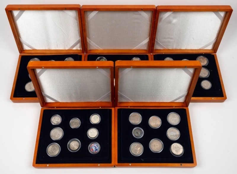 A range of World coins attractively presented in five timber coin storage boxes; noted British Commonwealth, U.S.A., early Germany, etc. (Total: 120).