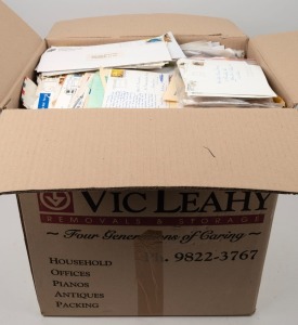 Large carton containing an untidy accumulation of mail (Australian and foreign), loose stamps (on and off paper), postcards, etc. Heavy!