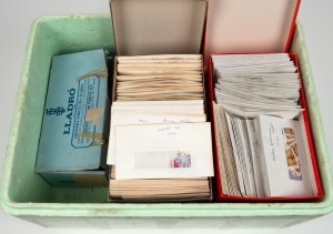A used accumulation arranged in envelopes in 5 shoeboxes, (1000s).
