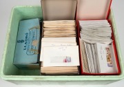 A used accumulation arranged in envelopes in 5 shoeboxes, (1000s).