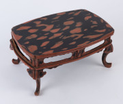 A Japanese red lacquered stand, Meiji period, circa 1900, ​15cm high, 33cm wide, 23cm deep