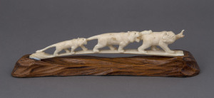 A Japanese carved ivory animal bridge on wooden stand, circa 1930, 27cm long overall