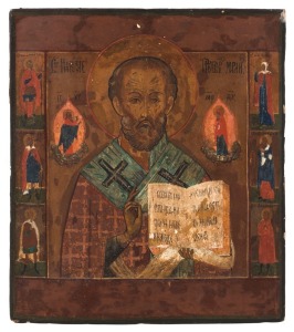 ICON: Tempera overpainted on a fine older panel, depicting St. Nicholas the Wonder Worker with attendant saints, Russian, late 19th century (but probably over an earlier image), 35 x 30.5cm.