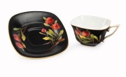 ROYAL WORCESTER "Waratah" antique English porcelain cup and saucer on rare black ground, signed "E. PHILLIPS", puce factory mark to base "Royal Worcester, Waratah, Flavelle Brothers Ltd.", the saucer 12cm wide - 2