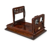 Stereo graphoscope featuring stereo viewer on hinged platform and&nbsp;fold-away magnifying postcard viewer, c. 1870, with beautiful carved floral details and 'Fred K. Cox 98 Newgate St London' retailer's plaque. - 2