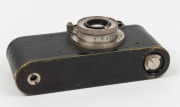 LEITZ: Black-body/chrome-fittings Leica II Model D rangefinder camera [#86985], c. 1932, with Elmar 50mm f3.5 lens, front lens cap, and leather case. - 4