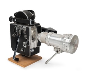 BOLEX-PAILLARD: H16 M1 16mm movie camera, c. 1958, with Som Berthiot Paris Pan-Cinor 17.5-70mm f2.4 lens [#AC4625] with lens cap, focal length adjustment lever, and viewfinder attachment.