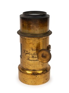 VOIGTLÄNDER: Brass Petzval lens with lens diameter of approx. 8cm, focal length of approx. 20cm, and total height of approx. 23cm, bearing inscription that reads 'No. 10843 Voigtländer & Sohn in Wien und Braunschweig'.