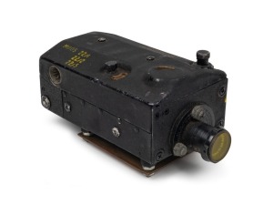 LACKNER: Wing-mountable AN-N6 Camera Gun 16mm movie camera [#61425], c. 1940s, with Wollensak Type-V 35mm f3.5 lens and lens filter. Marked 'Property of US Army Air Forces', this camera was used to confirm hits during sorties, operating only when the airc