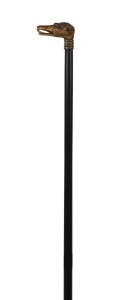 An antique walking stick with carved horn dog's head handle, gilt metal collar, ebony shaft and brass ferrule, 19th century, Ђ&lsaquo;86cm high
