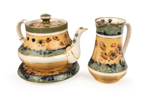 MACINTYRE antique English poppy patterned pottery teapot, trivet and milk jug designed by WILLIAM MOORCROFT, 19th/20th century, (3 items), brown factory mark to bases, the jug 15cm high