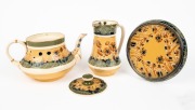 MACINTYRE antique English poppy patterned pottery teapot, trivet and milk jug designed by WILLIAM MOORCROFT,&nbsp;19th/20th&nbsp;century, (3 items), brown factory mark to bases, the jug 15cm high - 2