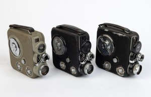 EUMIG: Three c. 1950s double-8 movie cameras - one Eumig C3 in grey, one Eumig C3 in black, and one Eumig C3 in black with differing front plate. (3 movie cameras)