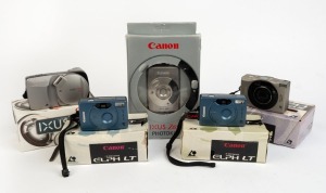 CANON: Five c. late 1990s compact cameras, all in maker's boxes with instruction booklets - one ELPH 370Z with leather case, two ELPH LT's, one Ixus Z65, and one Ixus Z90 with leather case. (5 cameras)