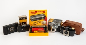 KODAK: Group of five cameras - one Jiffy Kodak Six-20 Series II, one Bullet Camera in maker's box, one Retinette IA in maker's box, one Brownie 127 in leather case, and one Brownie II subminiature camera in maker's box. (5 cameras)