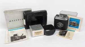 HASSELBLAD: Three accessories, each in maker's box with printed matter - one Lens Shade ⌀50/80, one Film Magazine A16, and one Magazine 80 For Polaroid Film. (3 items)