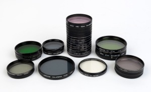 VARIOUS MANUFACTURERS: Accumulation of thirty-two lens filters, with diameters ranging from 72mm to 49mm. (32 items)