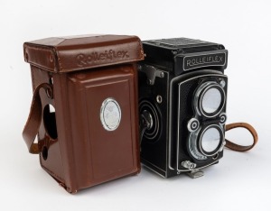 ROLLEI: Type 1 Rolleiflex Automat (MX-sync.) TLR camera [#1404911], c. 1951, with Tessar 75mm f3.5 lens [#1065251], Synchro-Compur shutter, lens cap, and leather case.