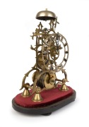 An antique English scroll frame passing strike skeleton clock with chain fusee movement, the wheelwork with four crossings on anchor escapement. Silvered brass pierced chaptering displaying Roman numerals, under glass dome with ebonised base, circa 1890, - 2