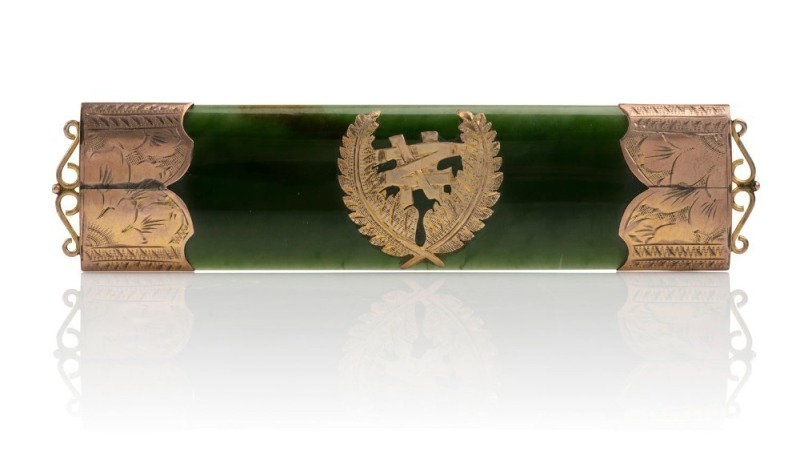 An impressive 9ct gold mounted New Zealand greenstone brooch, 19th century, and imposing 11.7cm wide.