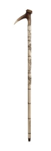 An antique Japanese walking stick with deer antler handle, carved segmented ivory shaft with monkey and figural decoration on brass ferrule, 19th/20th century, 91cm high