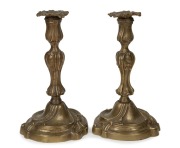 A pair of antique French Rococo Revival brass candlesticks, 19th century, 28cm high