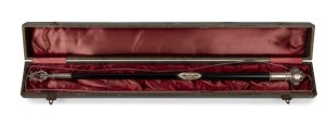 An antique German conductor's baton in presentation box, ebony with silver plated mounts, 19th century, the box 48cm wide