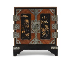 An antique Japanese miniature two door cabinet with gilt lacquer finish, Meiji period, 19th century, 15cm high