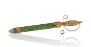 An antique New Zealand greenstone and 9ct gold sword brooch, 19th century, 6.5cm long