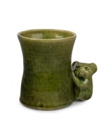 MERRIC BOYD green glazed pottery vase with applied koala, incised "Boyd, 1923", 10.5cm high, 13cm wide