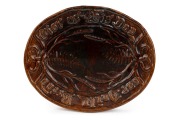 MILTON POTTERY (New Zealand) brown glazed oval bread platter, 19th century, 29.5cm wide