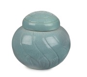 KLYTIE PATE lidded vase of spiraling shell form, incised "Klytie Pate, '83", 23cm high, 24cm wide