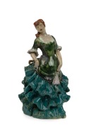 MARGUERITE MAHOOD&nbsp;pottery statue of a lady in a crinoline dress, incised signature near base (partially illegible), 24cm high