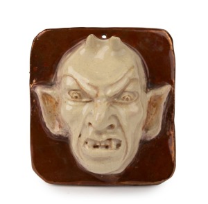 MARGUERITE MAHOOD pottery devil face plaque with unusual copper glazed incised "M. Mahood", 10 x 9cm