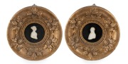 A superb pair of carved ivory profile portraits in circular frames, early 19th century. Purchased from Christie's Melbourne, from the family of Matthew Flinders. Each 31cm diameter overall.